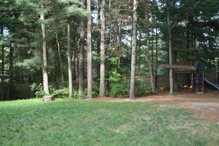 46 Deer Ridge Road Mashpee, MA 02649 - Photo 33 of 33 a view of a house with a backyard