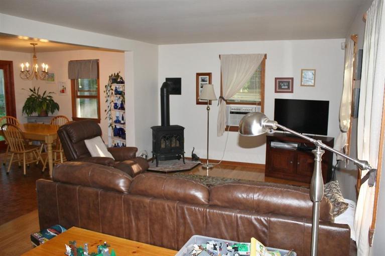 46 Deer Ridge Road Mashpee, MA 02649 - Photo 4 of 33 a living room with furniture a flat screen tv and a fireplace