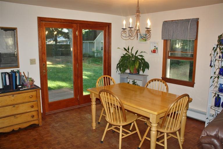 46 Deer Ridge Road Mashpee, MA 02649 - Photo 5 of 33 a view of a dining room with furniture a chandelier and window