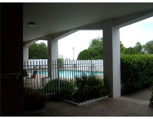 a open area with garden in the background