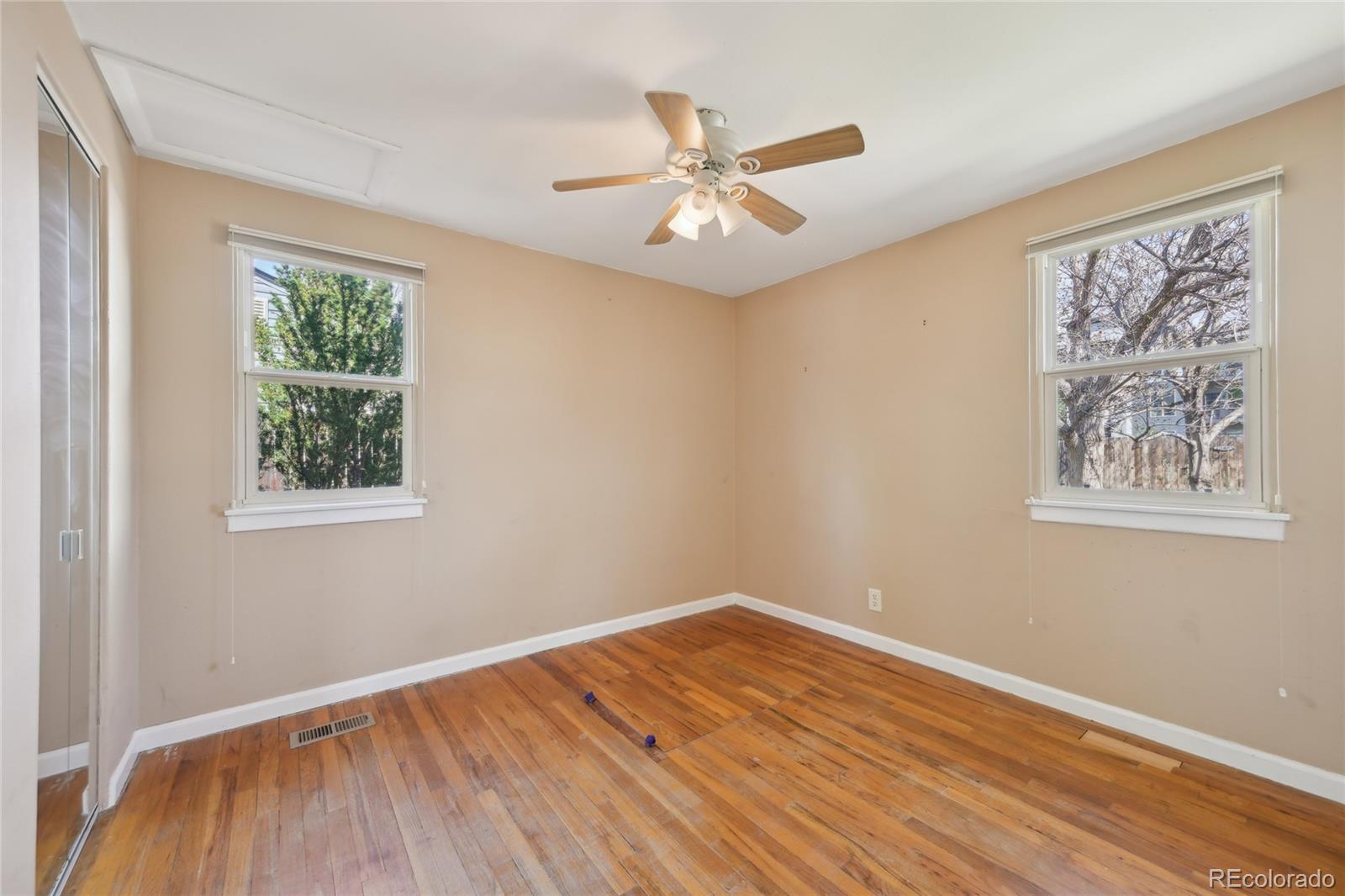 6819 Reno Drive Arvada, CO 80002 - Photo 20 of 32 a view of a room with wooden floor and window