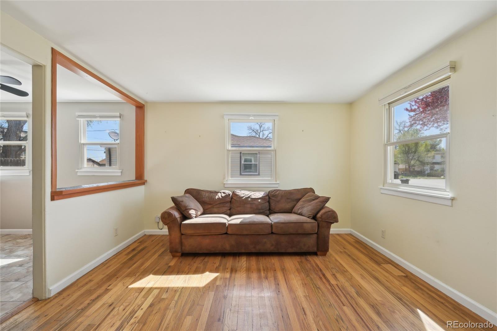 6819 Reno Drive Arvada, CO 80002 - Photo 4 of 32 a living room with furniture and a window