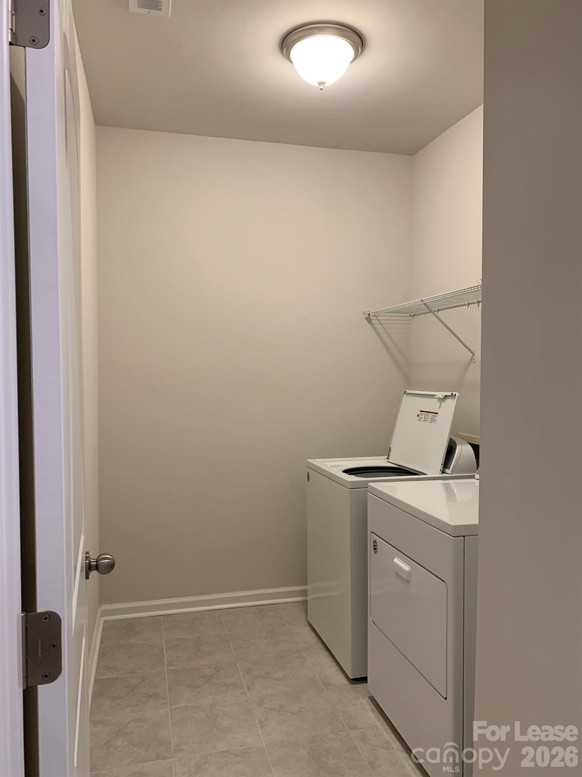 2143 Stevens Mill Road Matthews, NC 28104 - Photo 28 of 39 a utility room with dryer and washer