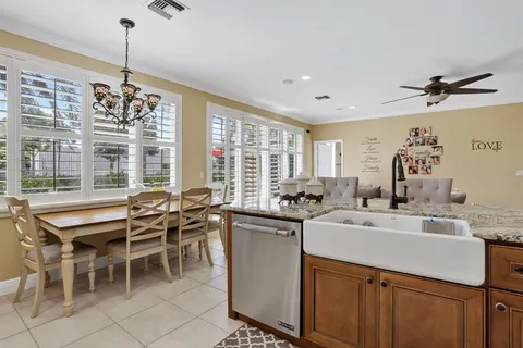 a spacious bedroom with a bed and a flat screen tv
