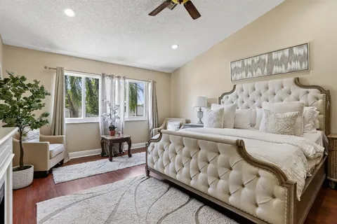 a view of a patio with table and chairs under an umbrella