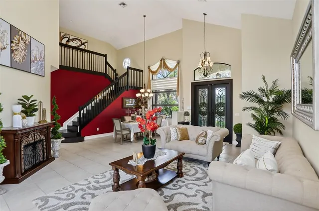 a view of a dining room with furniture and chandelier