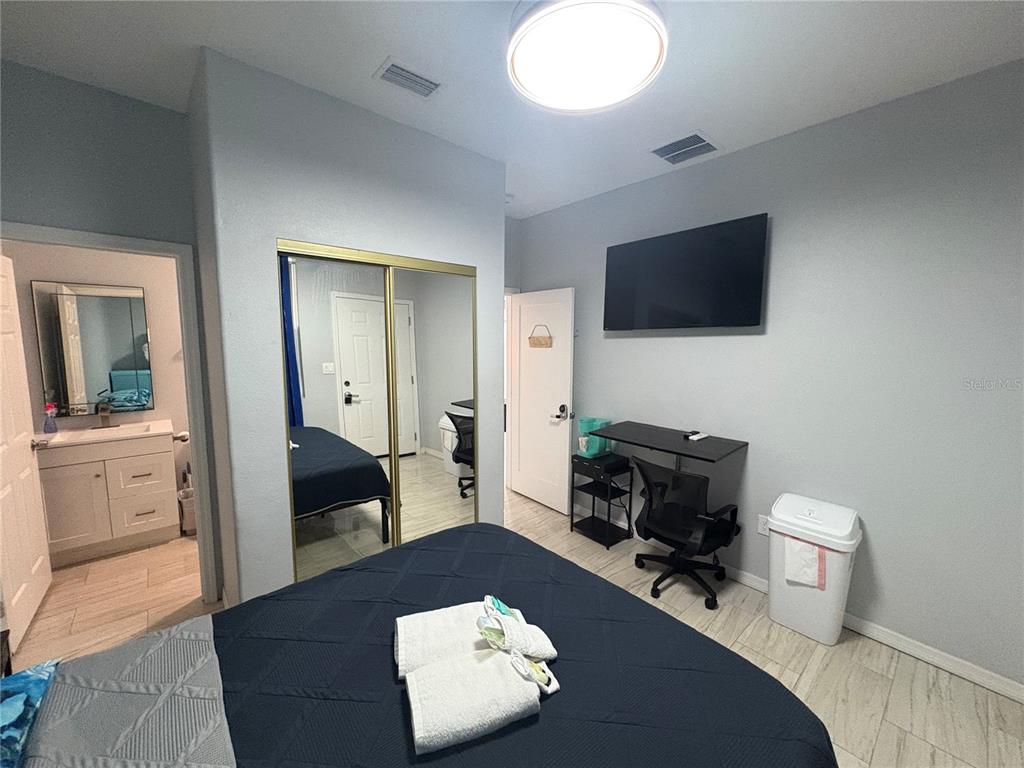 3715 Valley Tree Drive Tampa, FL 33610 - Photo 14 of 26 a living room with furniture and a flat screen tv