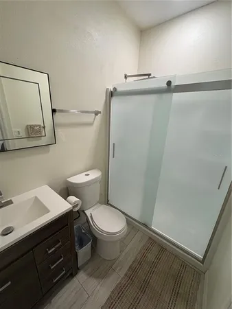 a bathroom with a sink a toilet and vanity