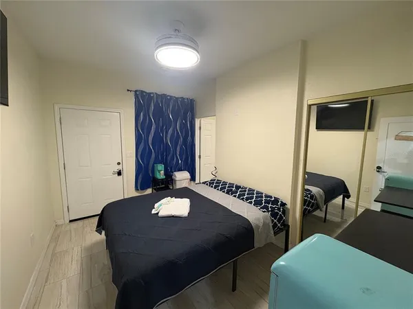 a bedroom with bed and a window