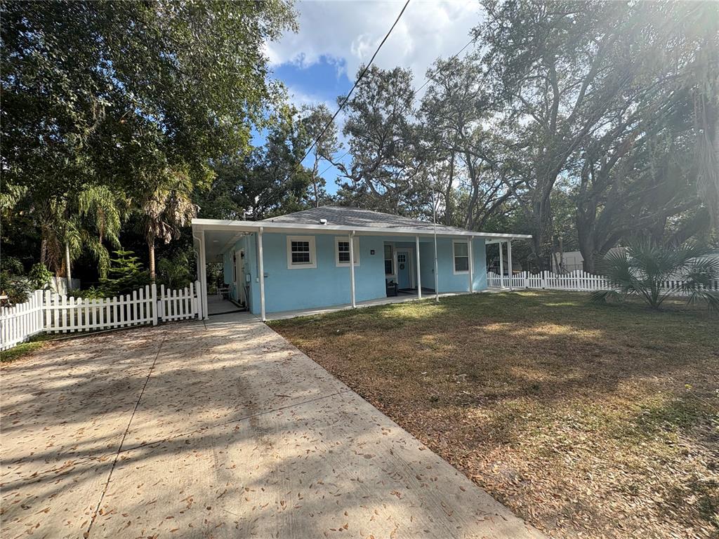 3715 Valley Tree Drive Tampa, FL 33610 - Photo 2 of 26 a view of a house with a yard