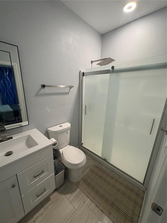 3715 Valley Tree Drive Tampa, FL 33610 - Photo 23 of 26 a bathroom with a sink toilet and shower