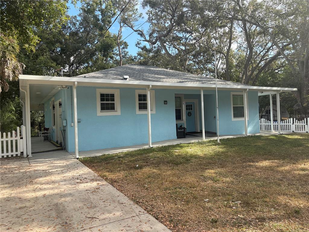 3715 Valley Tree Drive Tampa, FL 33610 - Photo 3 of 26 a view of a house with a backyard and balcony