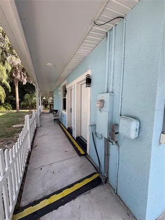 a view of a porch with wooden floor and stairs