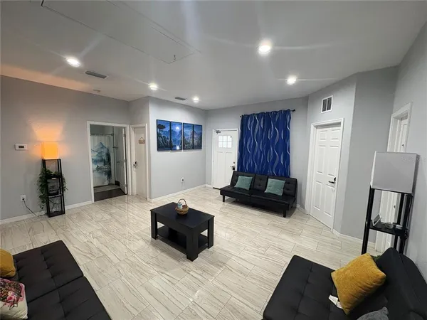 a living room with furniture and a couch