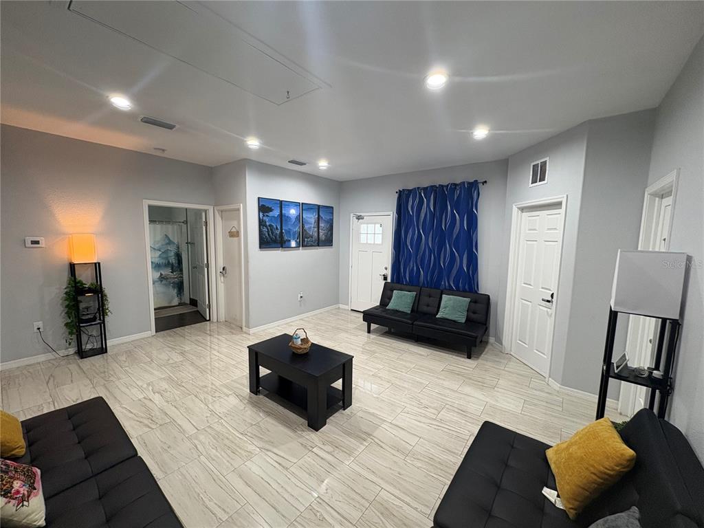 3715 Valley Tree Drive Tampa, FL 33610 - Photo 5 of 26 a living room with furniture and a couch