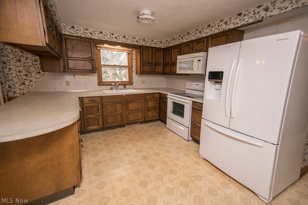 1877 Spring Valley Avenue Northwest Canton, OH 44708 - Photo 11 of 24 Kitchen with lots of counter space and storage. Again tons of potential!
