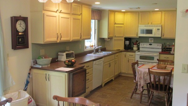 9 Highland Road Merrimac, MA 01860 - Photo 12 of 20 a kitchen with a sink stove and cabinets