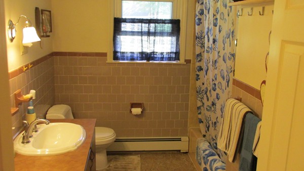 9 Highland Road Merrimac, MA 01860 - Photo 15 of 20 a bathroom with a sink a toilet and shower