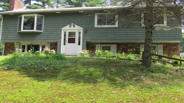 9 Highland Road Merrimac, MA 01860 - Photo 2 of 20 a front view of a house with garden