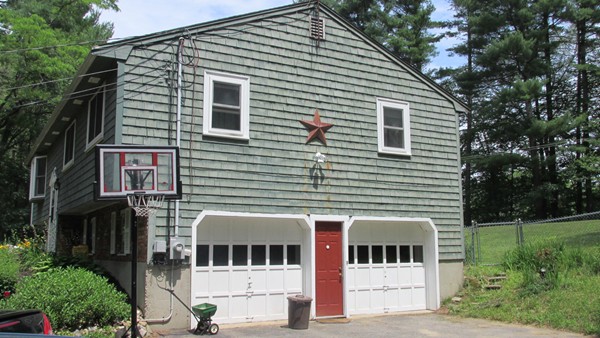 9 Highland Road Merrimac, MA 01860 - Photo 3 of 20 a view of a white house with large windows