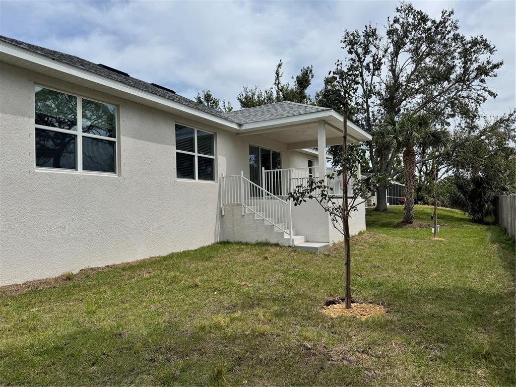1157 Duquesne Road Venice, FL 34293 - Photo 14 of 15 a front view of a house with a yard