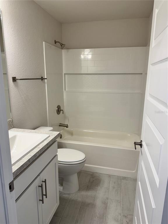 1157 Duquesne Road Venice, FL 34293 - Photo 2 of 15 a bathroom with a sink a toilet and a bathtub