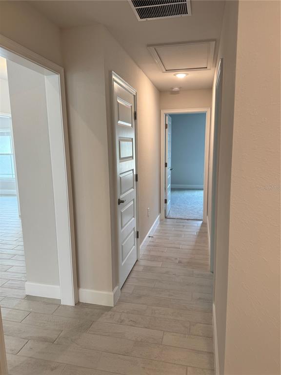 1157 Duquesne Road Venice, FL 34293 - Photo 4 of 15 a view of a hallway with wooden shelves