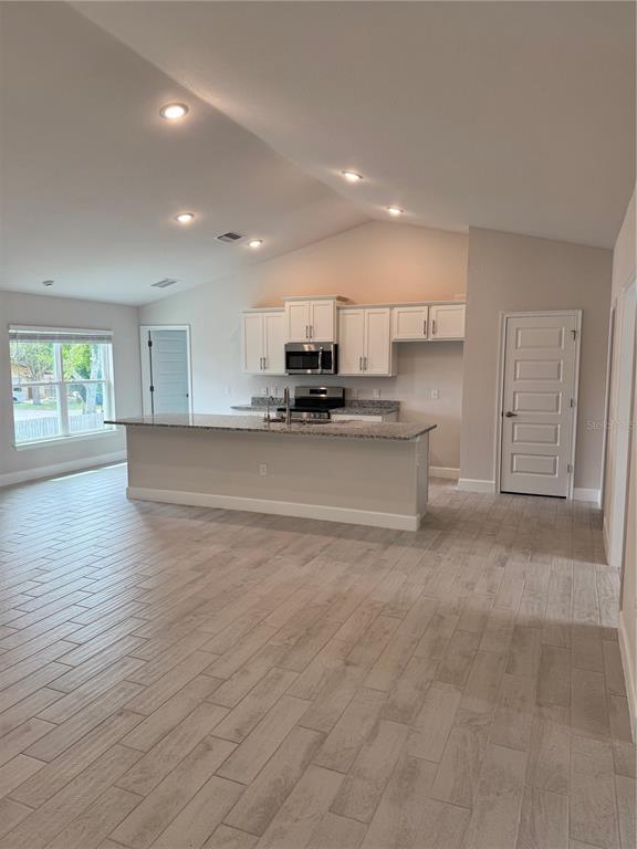 1157 Duquesne Road Venice, FL 34293 - Photo 8 of 15 a view of a kitchen with a sink and a stove top oven