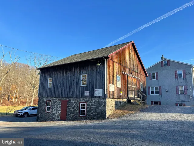 a view of a house with a street