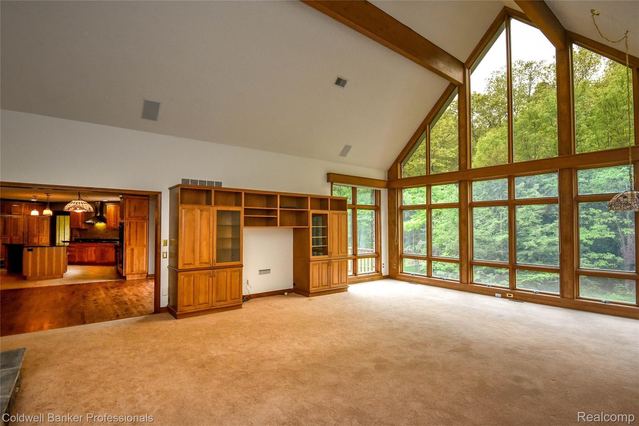 9275 Fox Hollow Road Clarkston, MI 48348 - Photo 22 of 68 2 Story Great Room with Built Ins and view to Dinette and Kitchen