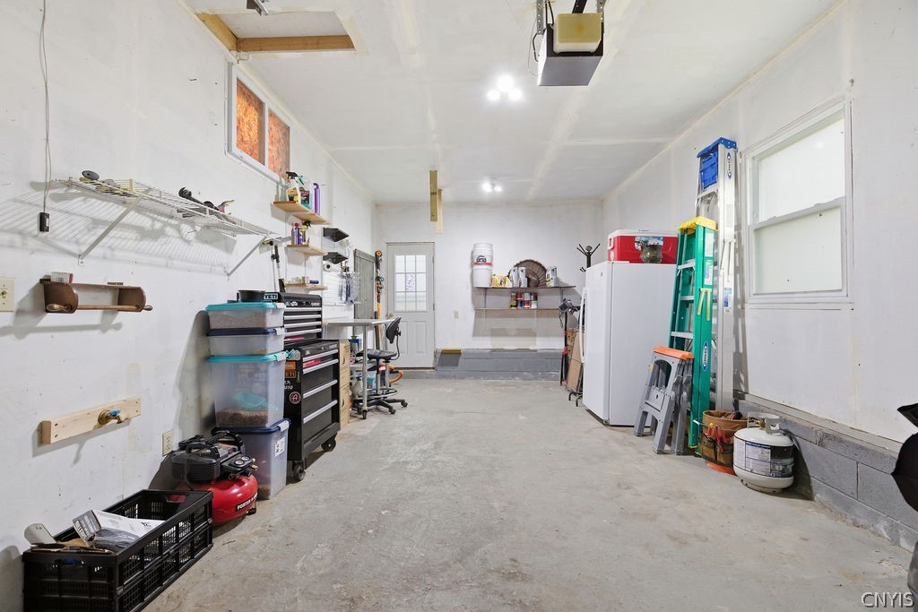 7017 Bolivar Road Sullivan, NY 13037 - Photo 29 of 40 The door at the back of the garage leads directly