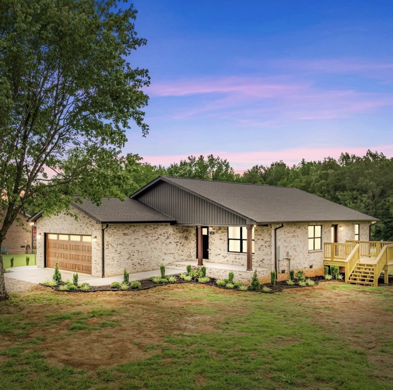 a front view of a house with a yard