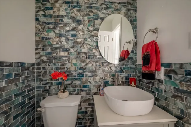 a view of a house with a tree in the yard