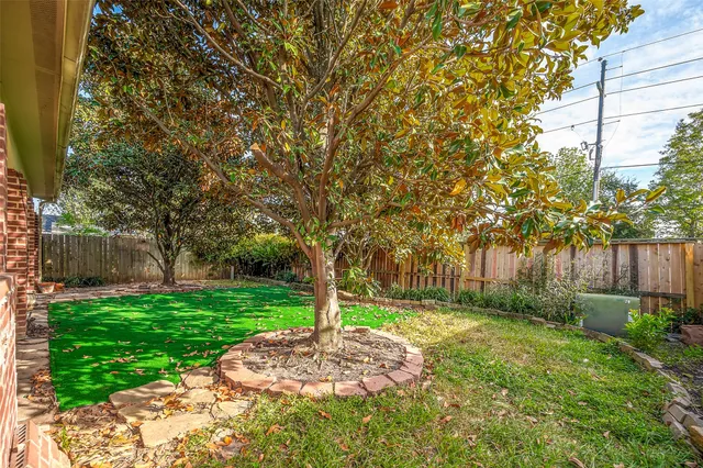 a backyard of a house with lots of green space
