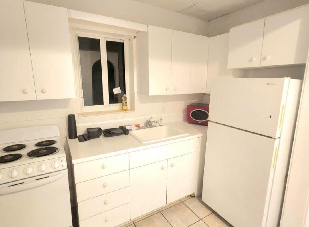 817 Tyler Street, Unit 3 Hollywood, FL 33019 - Photo 7 of 7 a bathroom with a sink and a mirror