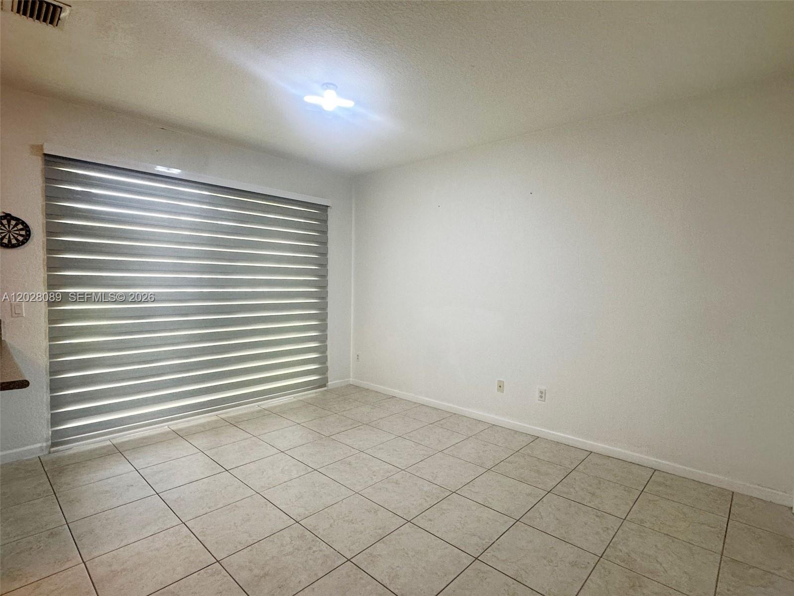 662 Northeast 21st Terrace Homestead, FL 33033 - Photo 11 of 34 an empty room with a white walls
