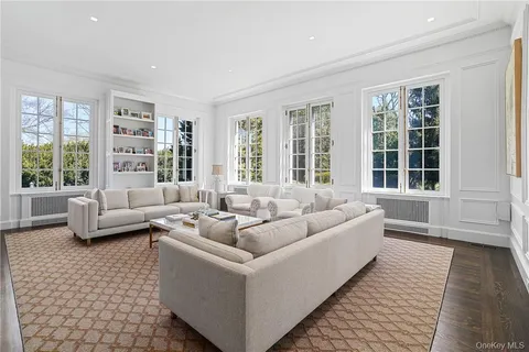 a living room with furniture and windows