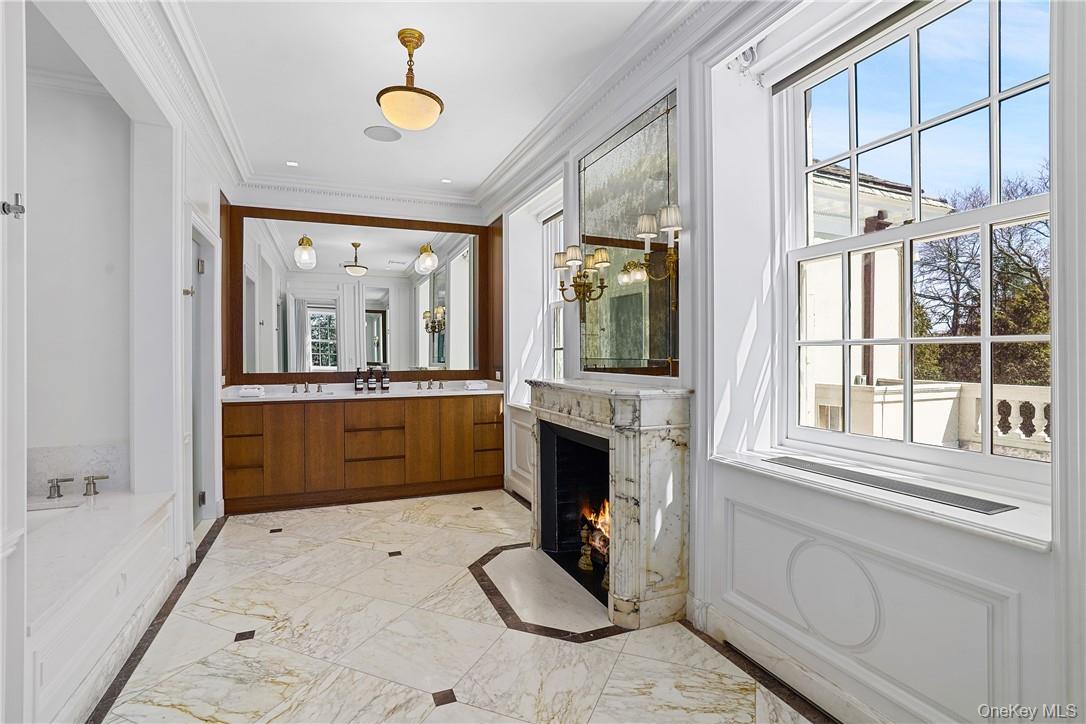 99 Mamaroneck Road Scarsdale, NY 10583 - Photo 17 of 35 Ensuite Spa Bathroom with Wood Burning Fireplace, and Double Vanity