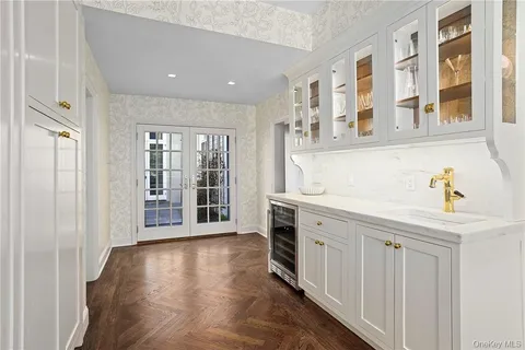 a view of a kitchen with a sink and a window