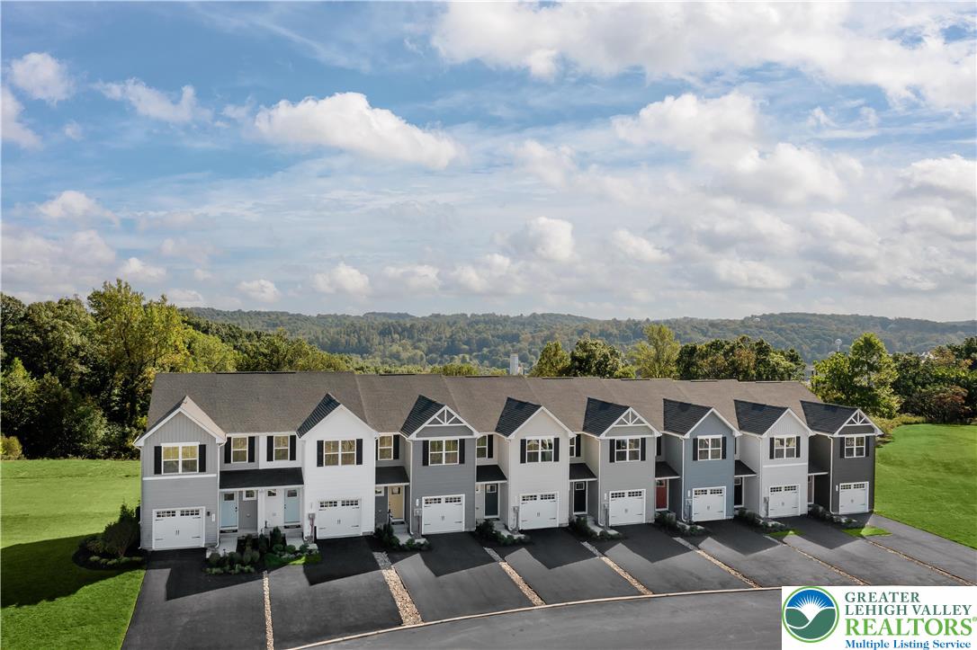 1 Shiloh Road, Unit P Orwigsburg, PA 17961 - Photo 2 of 15 a view of a white house with a yard and balcony