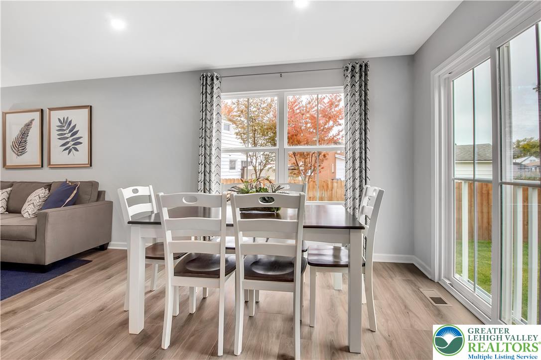 1 Shiloh Road, Unit P Orwigsburg, PA 17961 - Photo 9 of 15 a view of a dining room with furniture and wooden floor