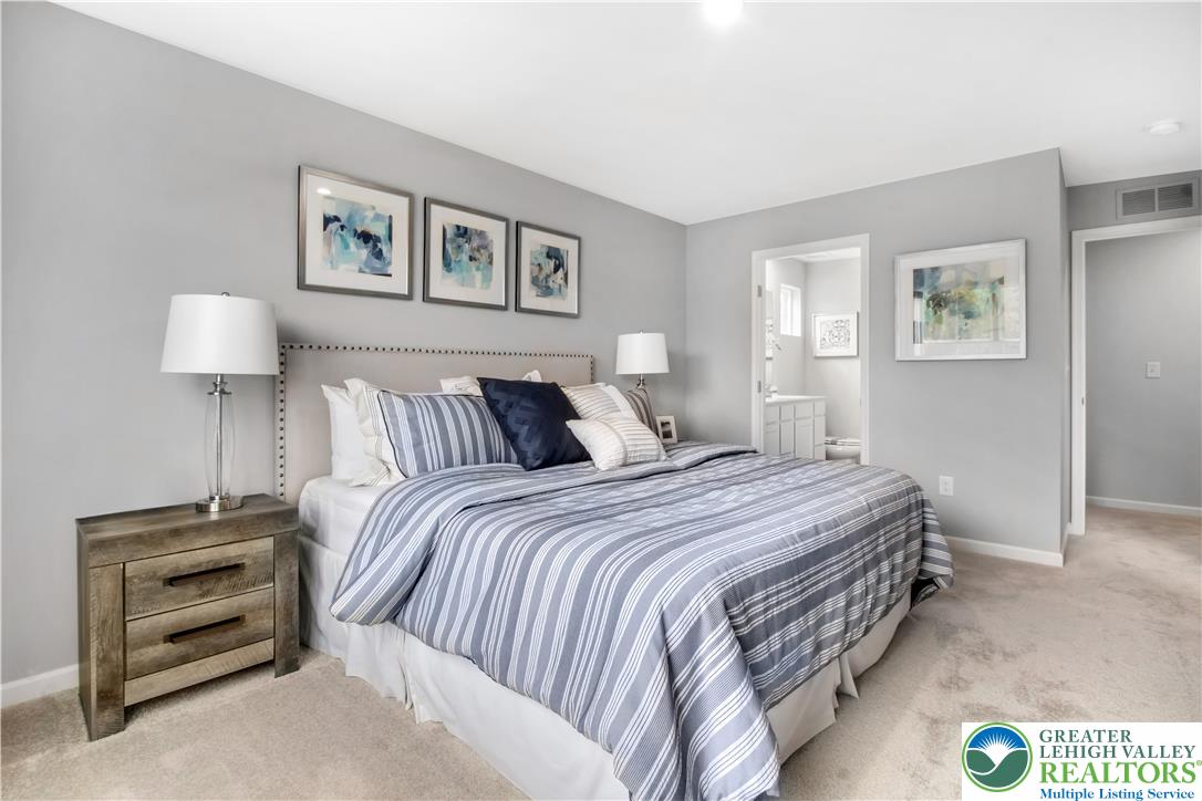 1 Shiloh Road, Unit P Orwigsburg, PA 17961 - Photo 10 of 15 a bedroom with a bed and a night stand