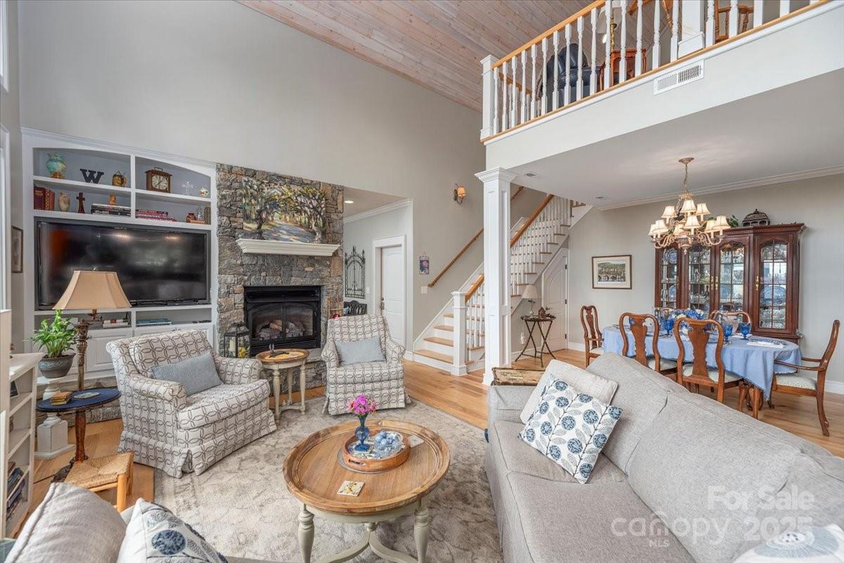 316 Fincher Mountain Road Waynesville, NC 28785 - Photo 11 of 46 a living room with furniture and a fireplace