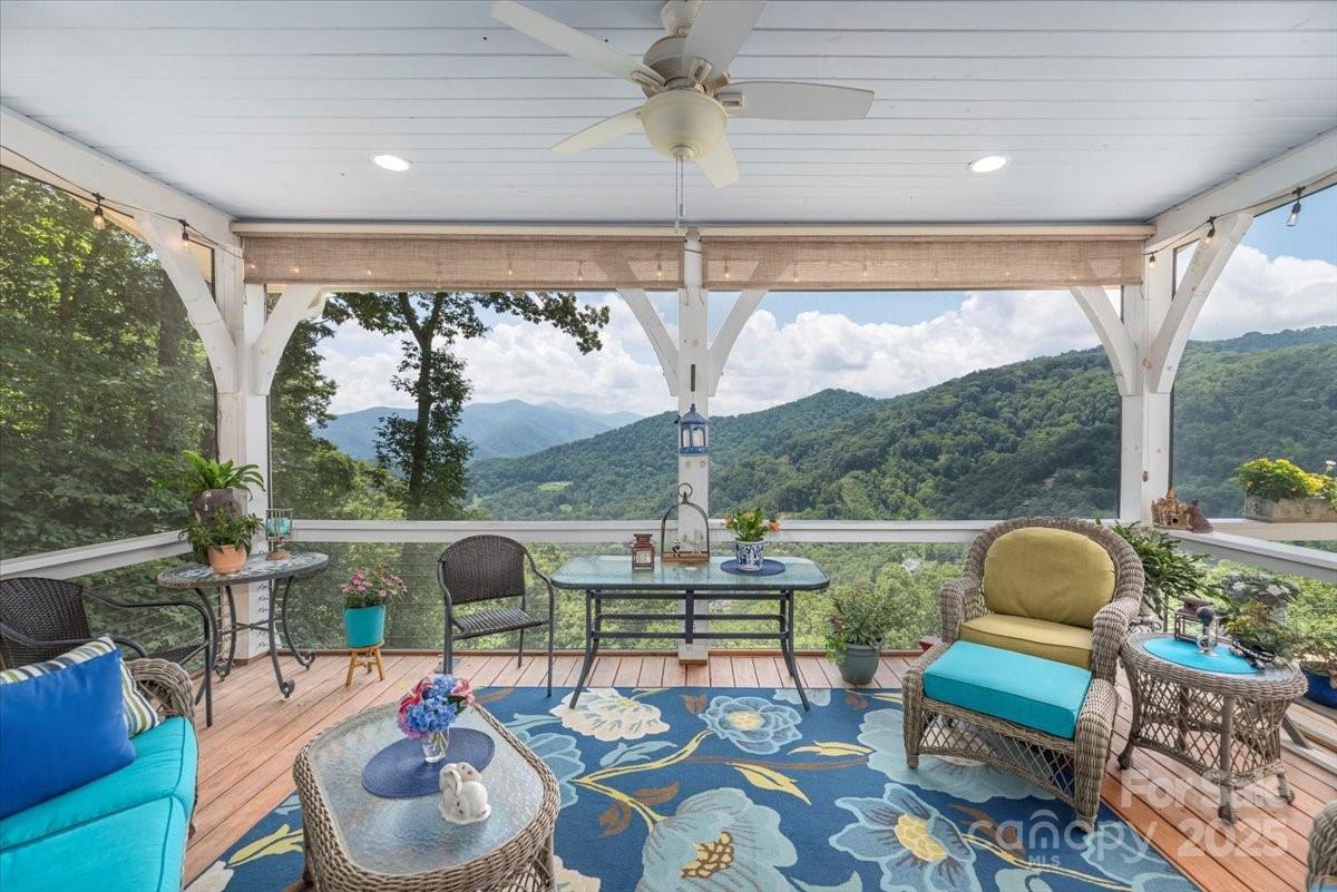 316 Fincher Mountain Road Waynesville, NC 28785 - Photo 23 of 46 a outdoor living space with furniture and a garden