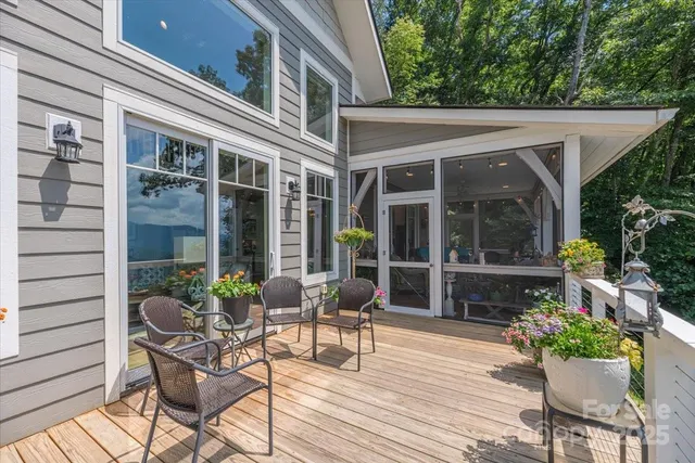 a view of a chair and tables in the balcony