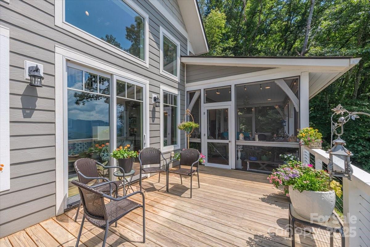316 Fincher Mountain Road Waynesville, NC 28785 - Photo 26 of 46 a patio with yard table and chairs