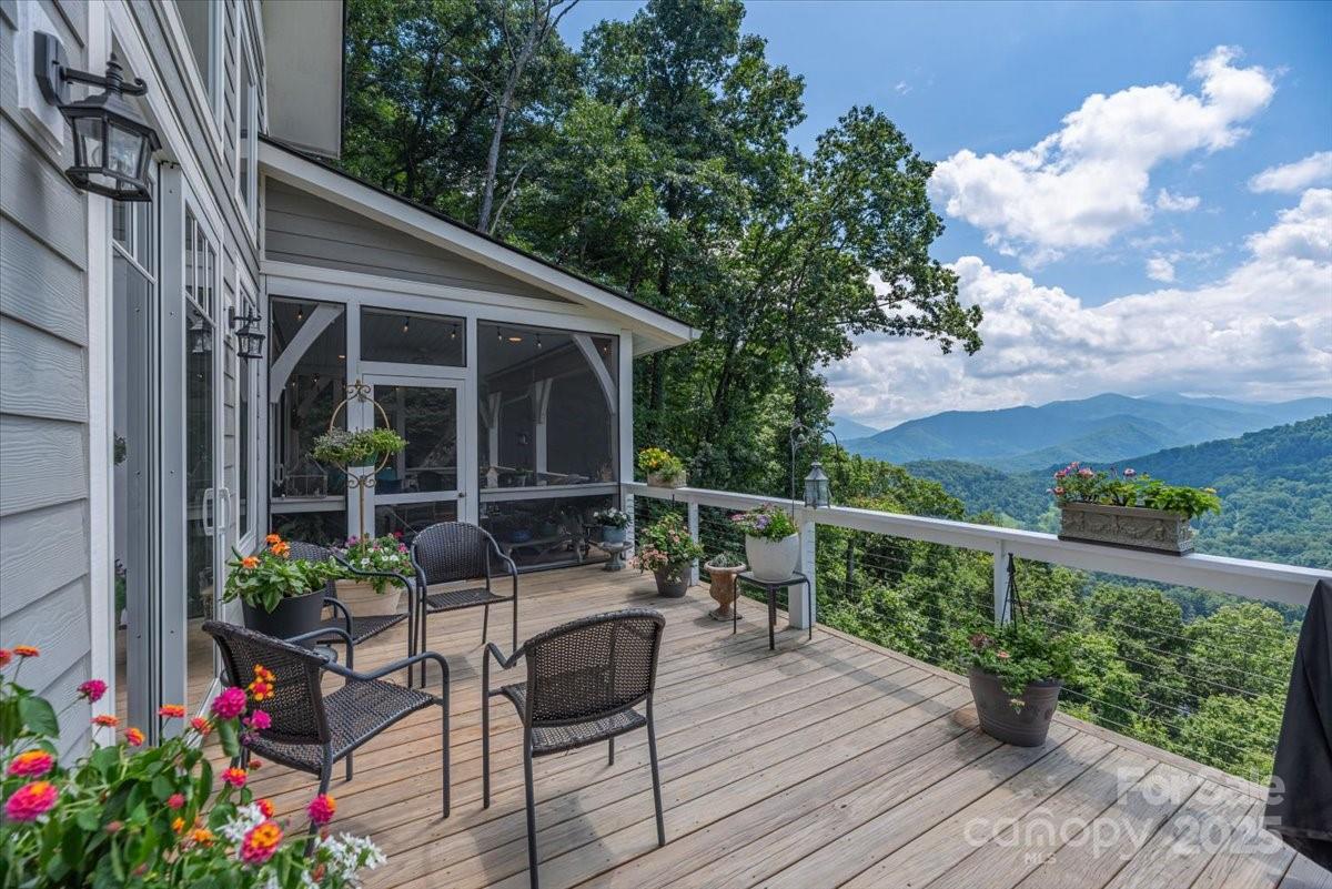 316 Fincher Mountain Road Waynesville, NC 28785 - Photo 27 of 46 a view of a chair and tables in the balcony