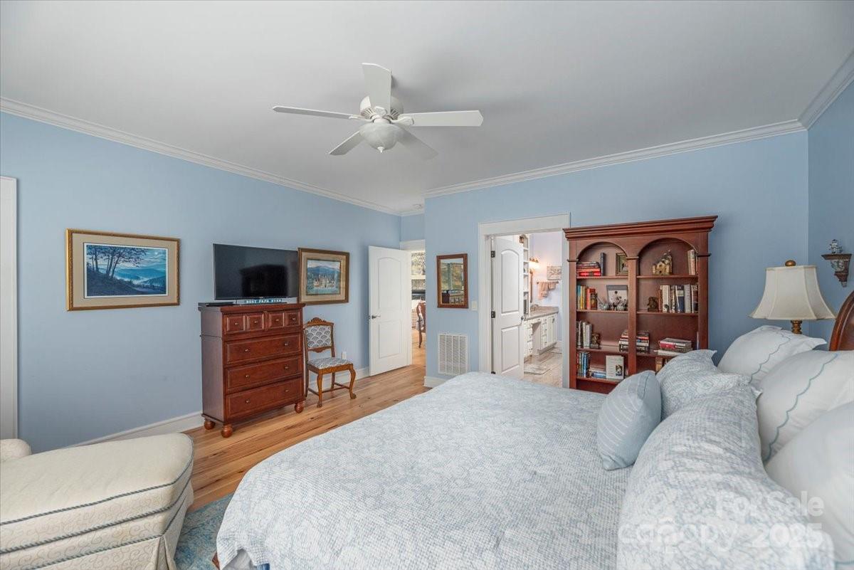 316 Fincher Mountain Road Waynesville, NC 28785 - Photo 29 of 46 a bed room with a bed and a television