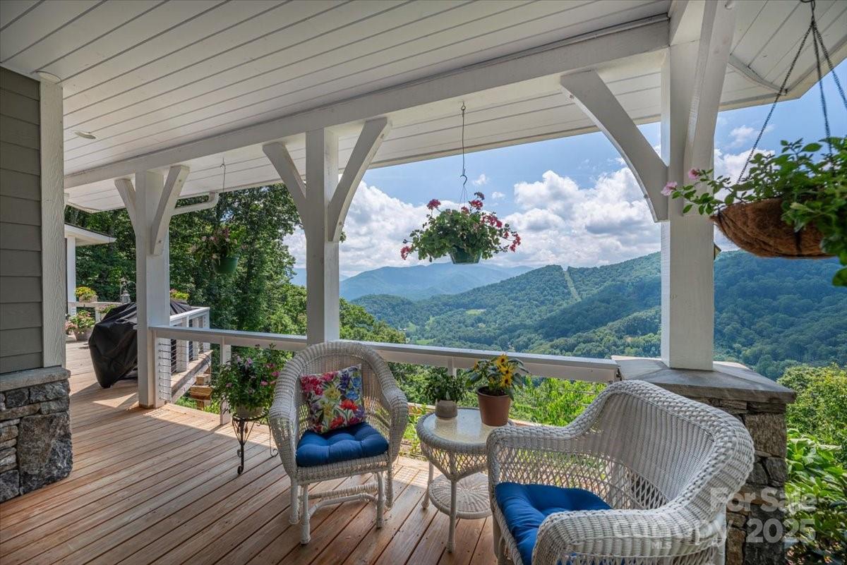 316 Fincher Mountain Road Waynesville, NC 28785 - Photo 3 of 46 a view of sitting area with furniture and wooden floor