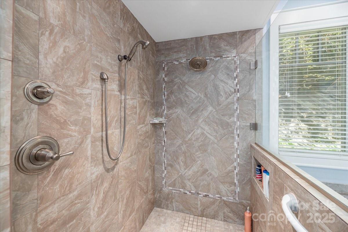 316 Fincher Mountain Road Waynesville, NC 28785 - Photo 32 of 46 a bathroom with a shower